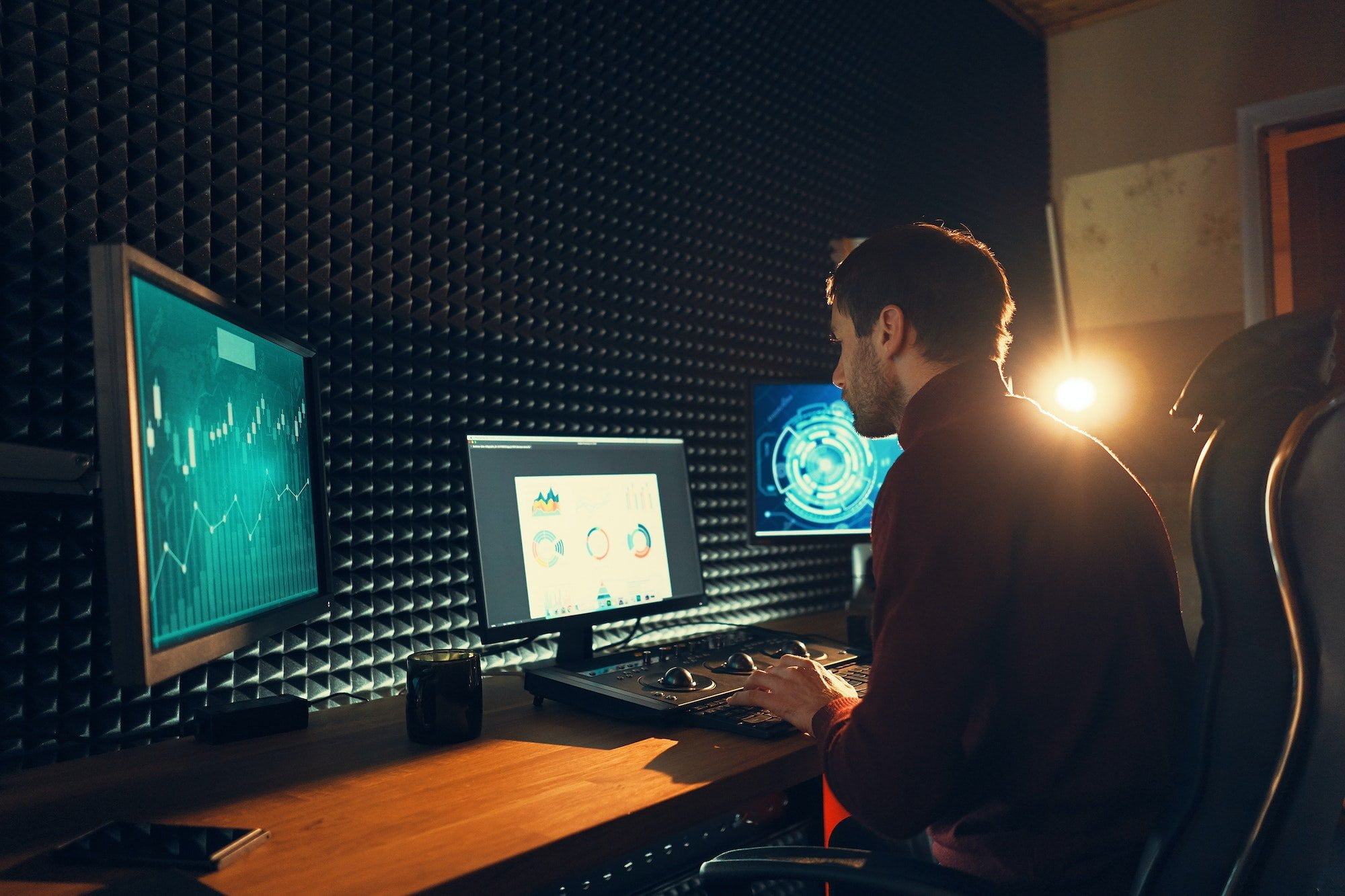 Male Videographer Edits and Cuts Footage and Sound on His Personal Computer