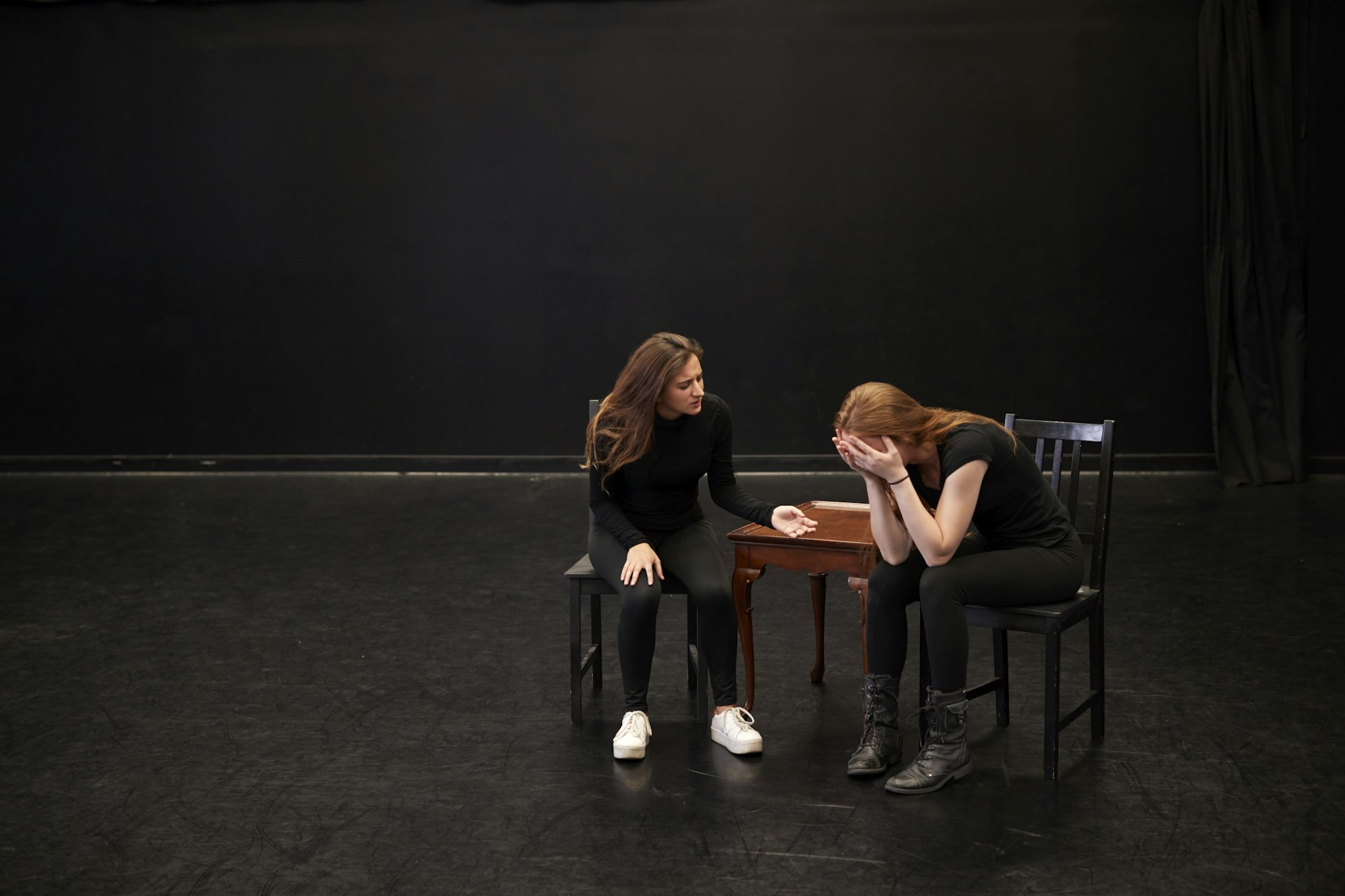 Two Female Drama Students At Performing Arts School In Studio Improvisation Class